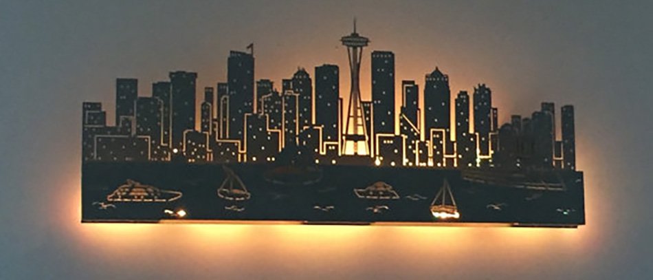 Acrylic laser cut backlit lamp on wall