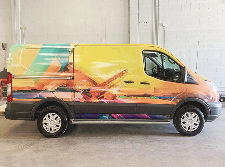 full vehicle branding with large colorful graphics made of opaque vinyl