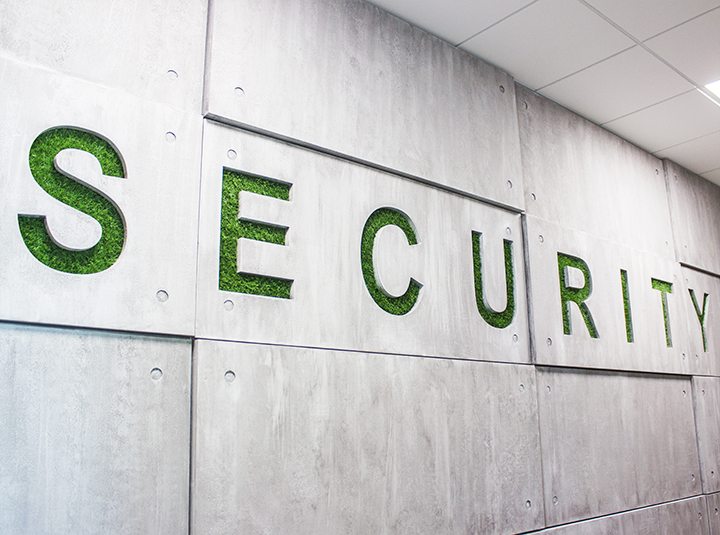 Ameriabank custom wood sign with the word Security engraved on the wall for green theme design