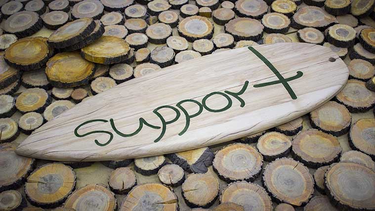 Wooden surfboard office sign