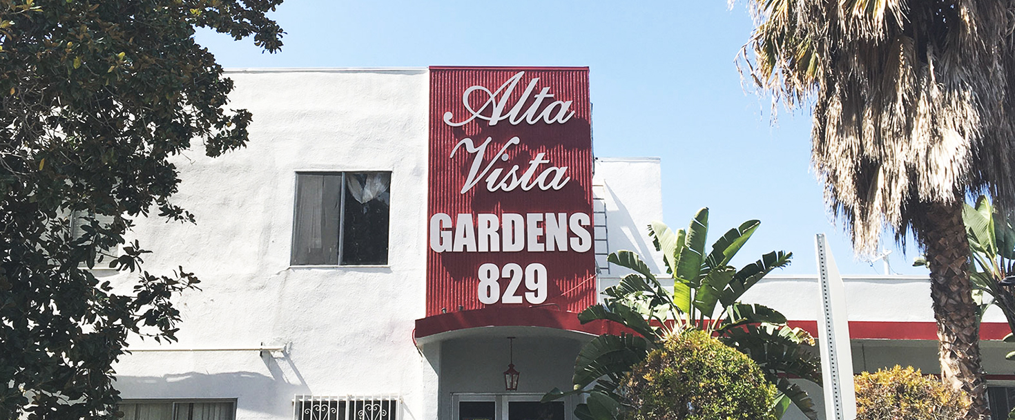 Alta Vista Gardens outdoor PVC sign displaying the brand name and address number