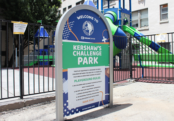 Aluminum pylon sign with the park's name placed near the play yard