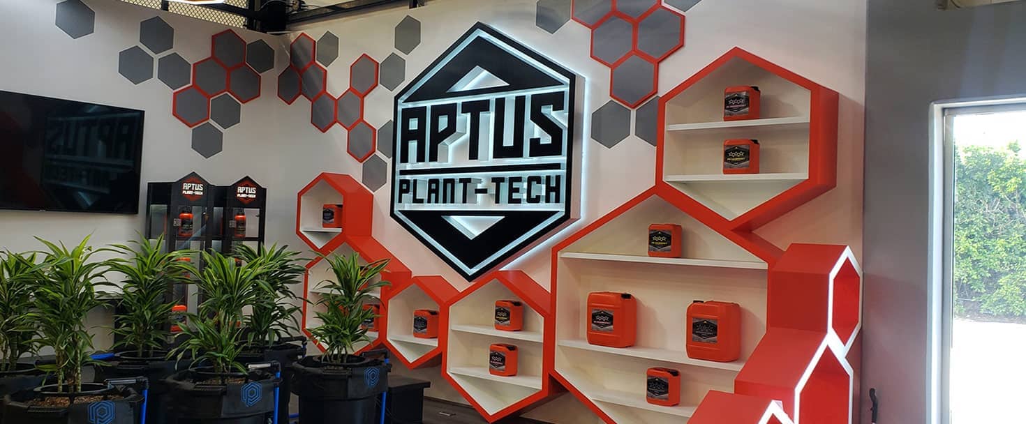 Aptus Plant-Tech interior signage with decorative structures made of acrylic, aluminum and wood