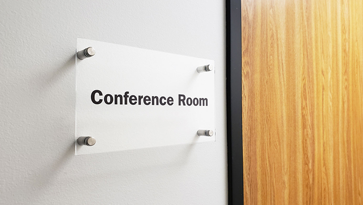 Conference room interior nameplate sign displaying the room's name made of acrylic