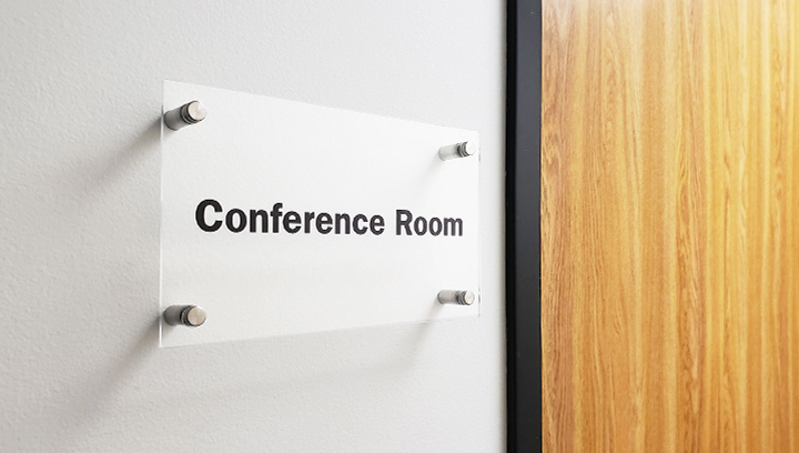 conference room frosted acrylic sign mounted to the wall with standoffs