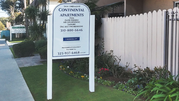 Continental Apartments freestanding aluminum sign displaying real estate information
