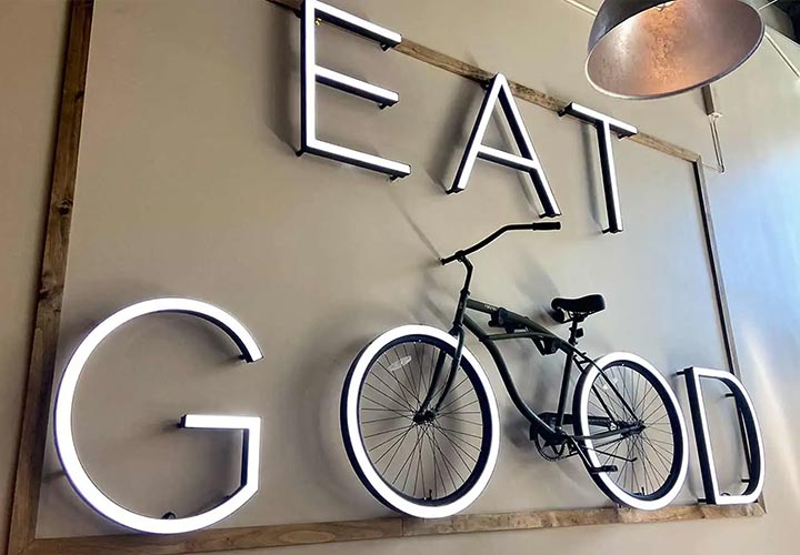 Eat Good channel letters with a bicycle construction made of aluminum and acrylic