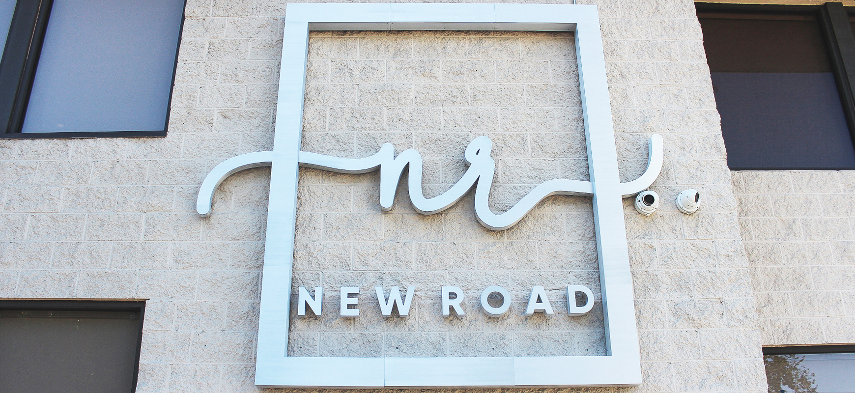 New Road aluminum channel letter sign in a big size displaying the company name and logo