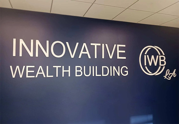 Innovative Wealth Building custom acrylic sign in white for interior branding