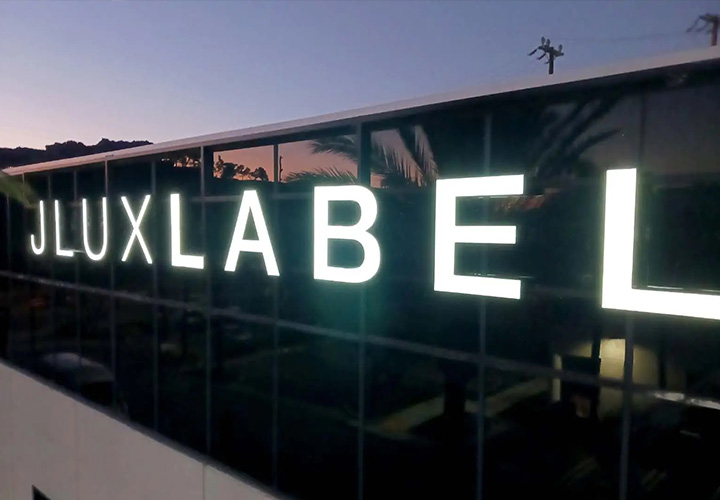 JLUXLABEL channel letter sign spelling the brand name made of Lexan and aluminum