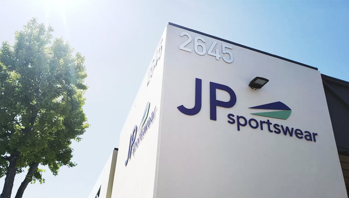 JP Sportswear outdoor metal sign displaying the company logo and name made of aluminum