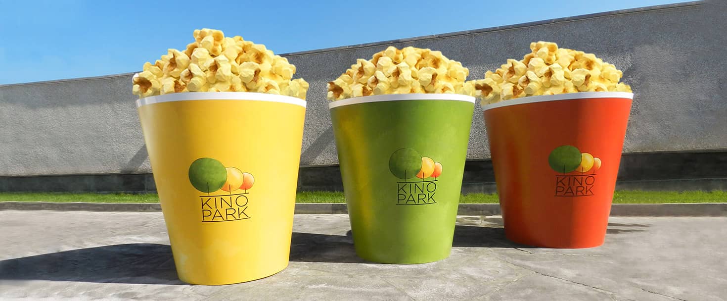 Kino Park custom PVC signs in the shape of large colorful popcorn buckets for cinema branding