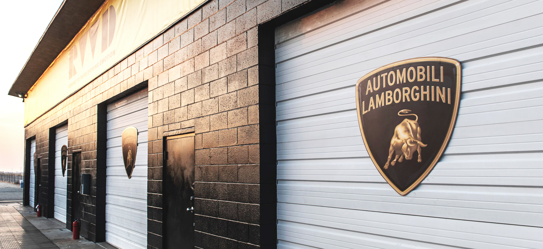 Lamborghini custom metal logo signs made of dibond displayed at the business outdoor venue