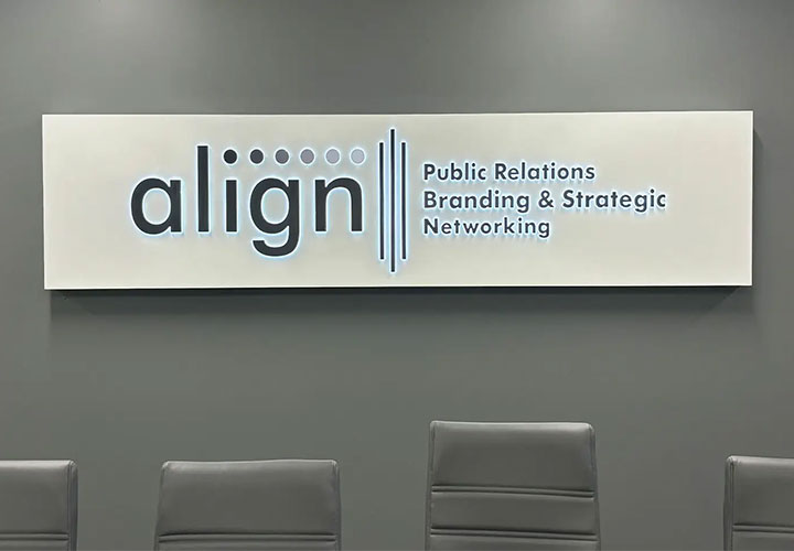 Indoor light box sign for Align PR featuring softly illuminated push-through letters