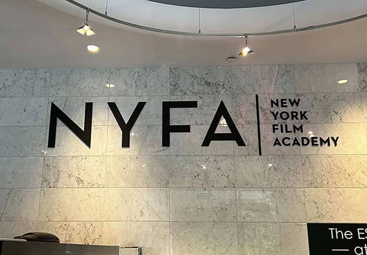 New York Film Academy interior sign displaying the brand name and logo made of acrylic