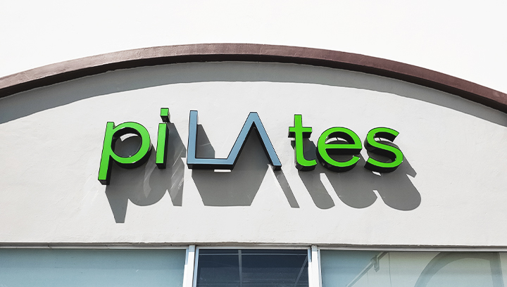 Pilates trim cap channel letters in green and grey colors made of aluminum and acrylic