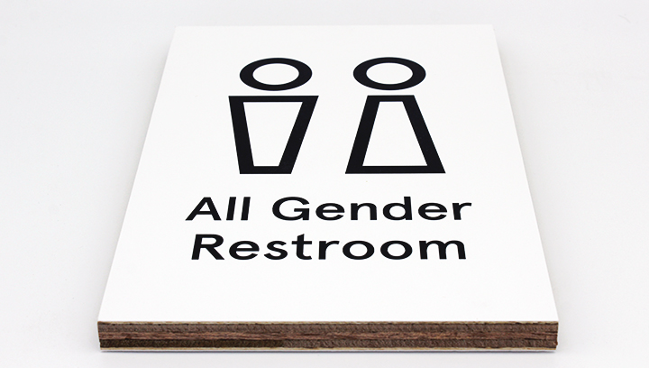 directional wooden sign displaying the phrase All Gender Restroom made of plywood