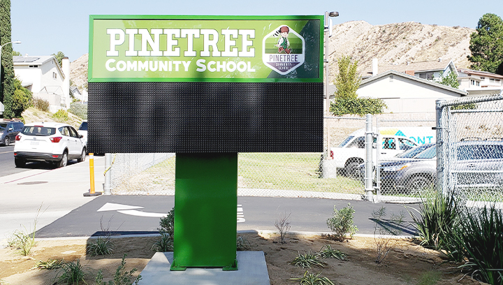 Pinetree Community School custom aluminum pylon sign in green color and big size