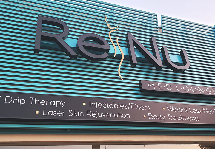 ReNu Med Lounge outdoor sign with a custom lighted logo and box designs