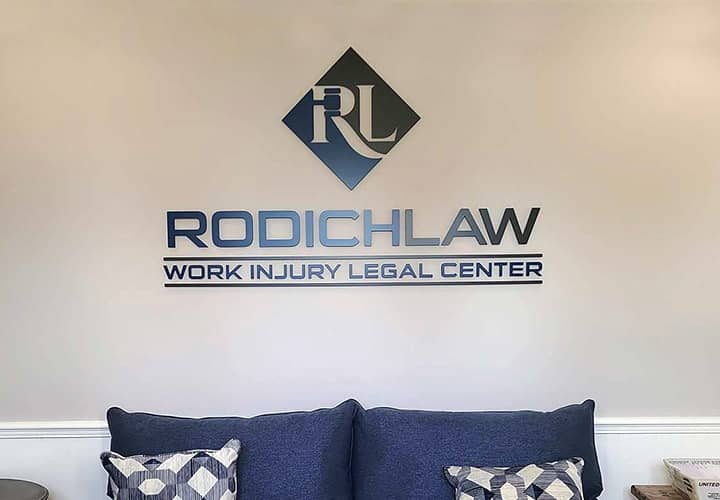 Rodich Law interior business sign with the company name and logo made of acrylic for branding