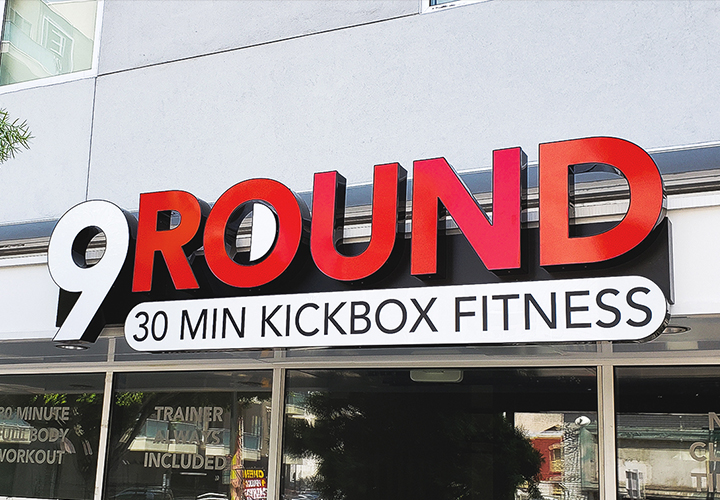 9 Round fitness brand logo in a light box sign and channel letters combination