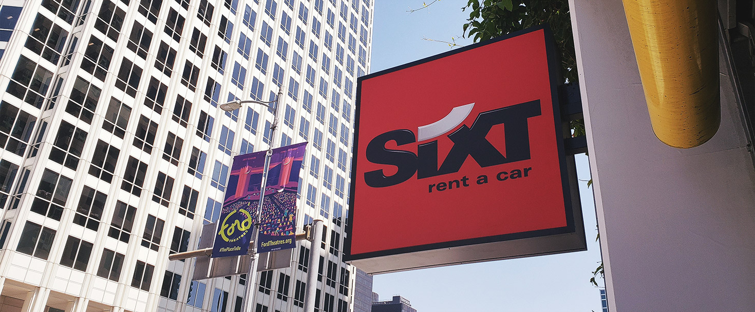 Sixt light box sign in a square shape and wall-blade style made of aluminum and acrylic