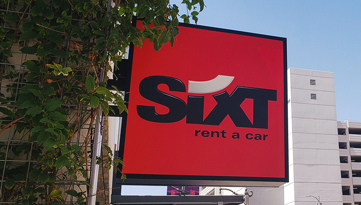 Sixt double-sided light box sign in red with the company name made of aluminum and acrylic
