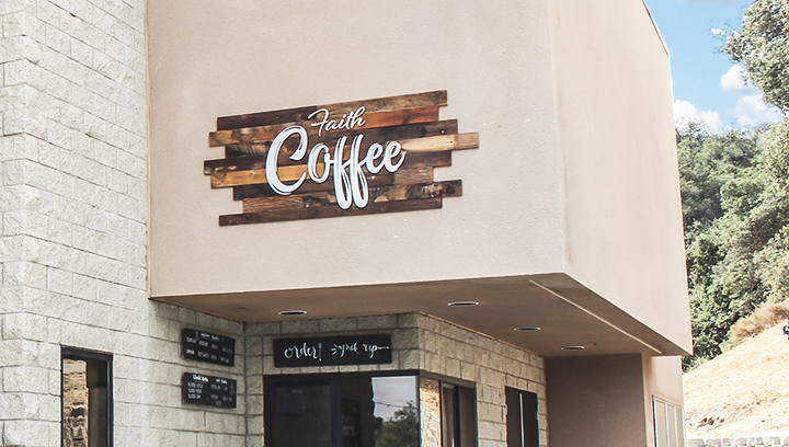 Faith Coffee restaurant custom wood sign with the company logo for rustic outdoor branding
