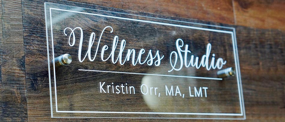 Wellness Studio wood sign with vinyl lettering