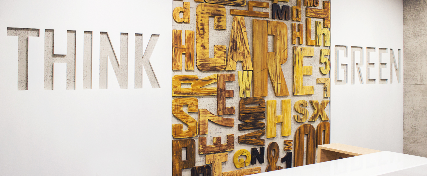 Ameriabank custom wood sign with cut out letters attached to the reception wall