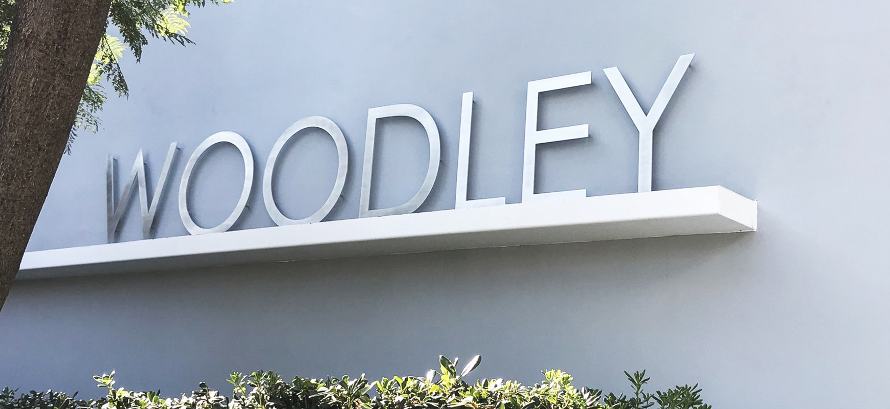 Woodley custom aluminum sign with brand name letters for outdoor branding