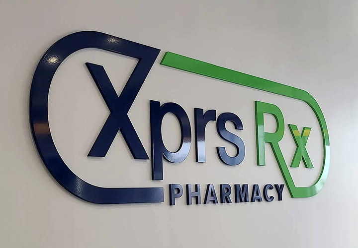 XPRS RX Pharmacy acrylic business sign displaying the company logo