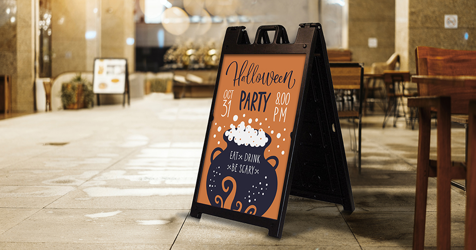 Halloween themed a-frame sign with promotional content