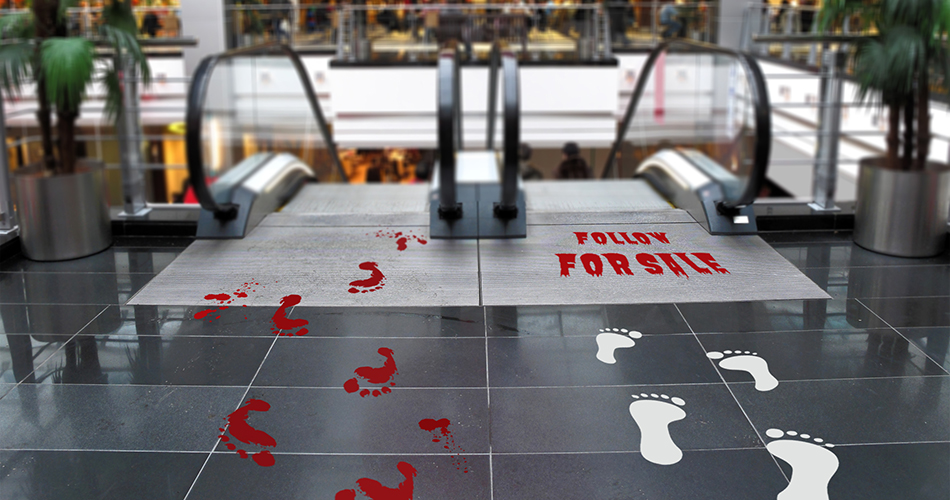 Follow For Sale floor decals in red color in the shopping mall