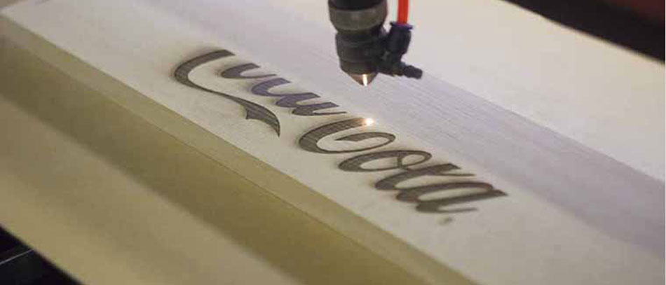 Laser-wood-etching-process-of-the-Coca-Cola-logo