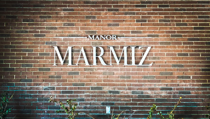 Manor Marmiz dimensional letter signage displaying the company name made of aluminum