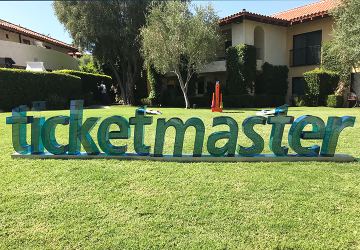 Ticketmaster 3D sign with transparent letters placed outdoors allowing light to pass through