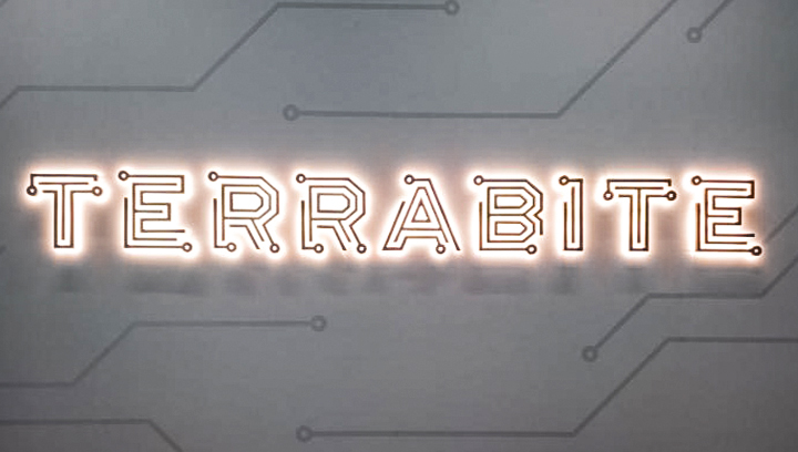 Light up sign for Terrabite, reading the company name with circuitry style letters