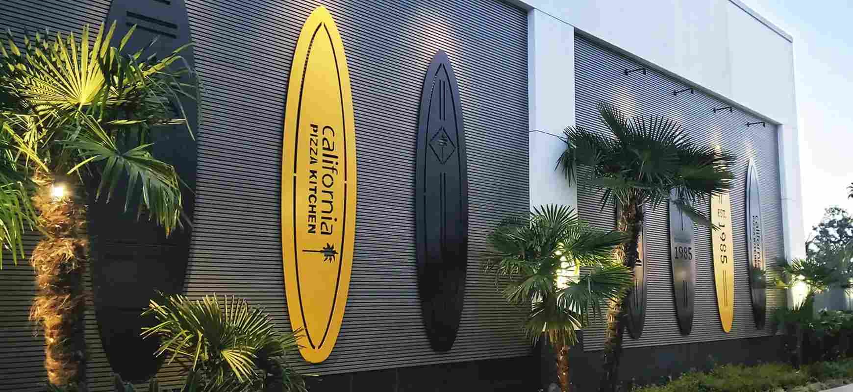 California Pizza Kitchen custom signs in surfboard shapes with aluminum, intended for branding