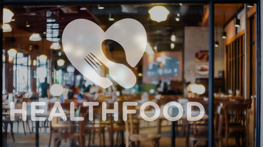 Healthfood custom vinyl lettering displaying the brand name next to the logo for branding