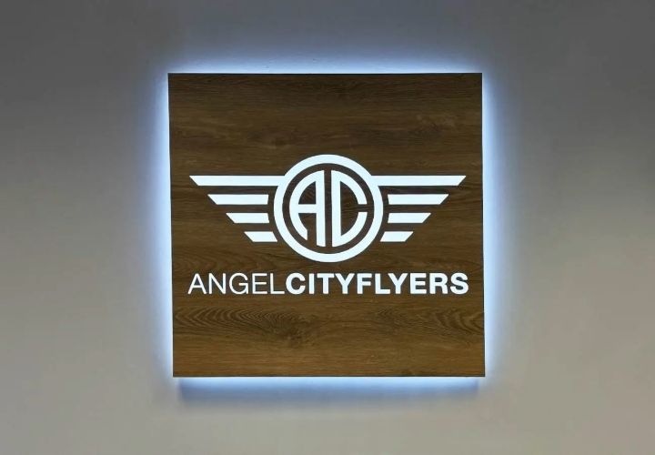 Light up signs for the Aero City Group Inc featuring the logo, made of wood and vinyl