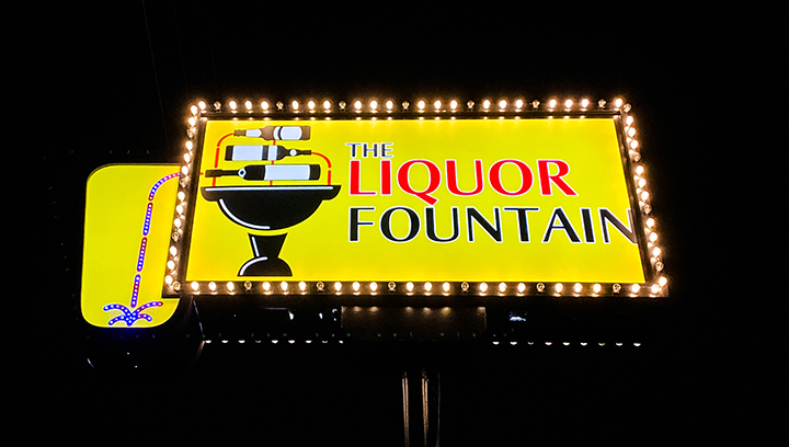 The Liquor Fountain Store light up sign for business in yellow made of aluminum and acrylic