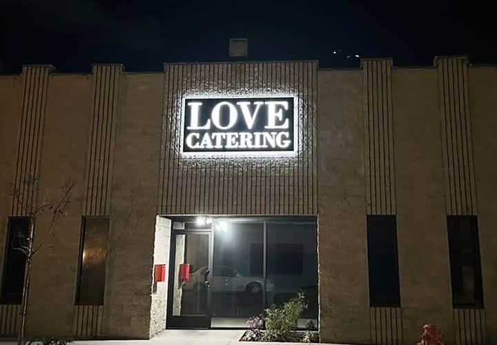 Love Catering light up sign in a rectangular shape made of aluminum and acrylic for the facade