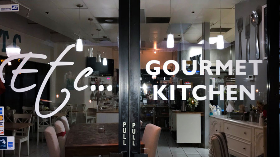 Gourmet Kitchen vinyl lettering in white made of opaque vinyl for entrance door branding