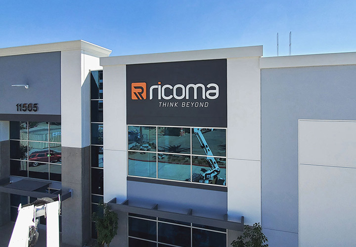 Ricoma custom signage showcasing the brand name and logo made of aluminum and PVC