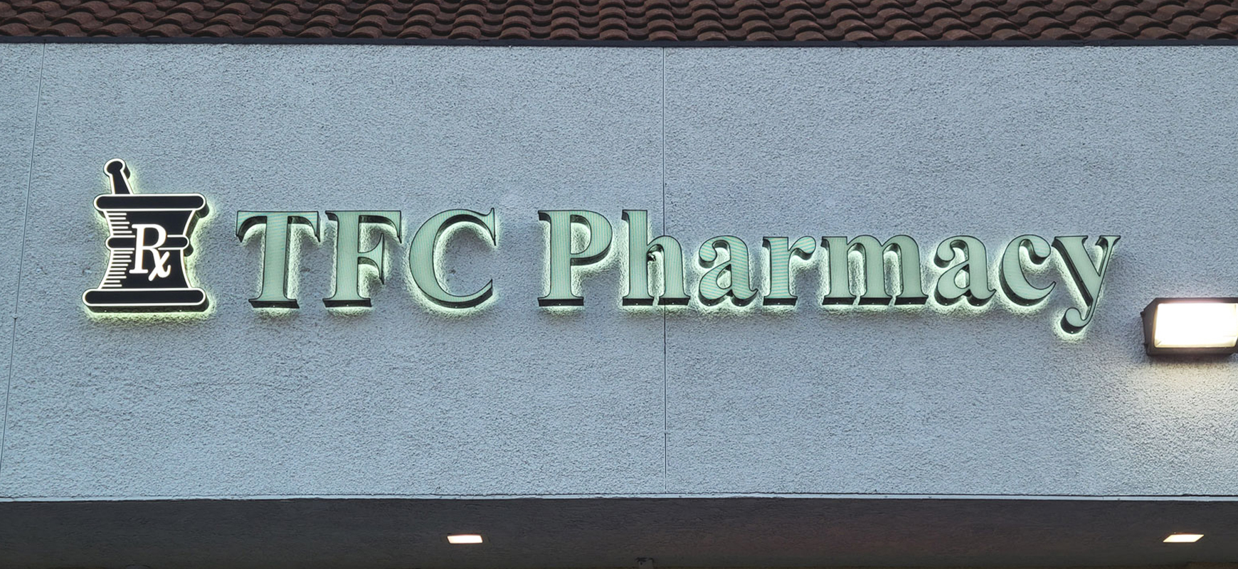 TFC Pharmacy custom light up sign with the brand name and logo made of aluminum and acrylic