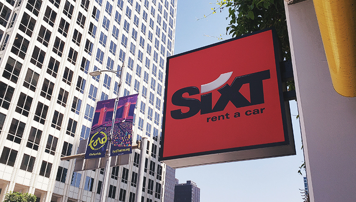 Sixt blade light up sign in a box shape and in red color made of aluminum and acrylic