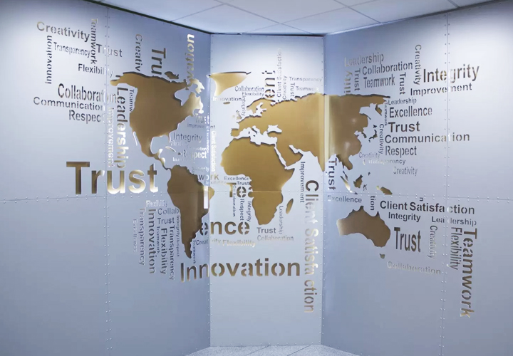 Large office signage displaying the world map in aluminum and intended for interior design