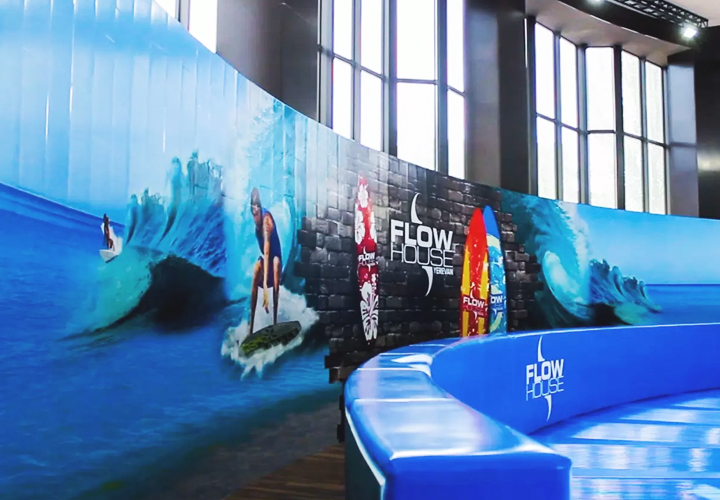 Flow House custom decals of a surf scene made of vinyl, a material also used in office design