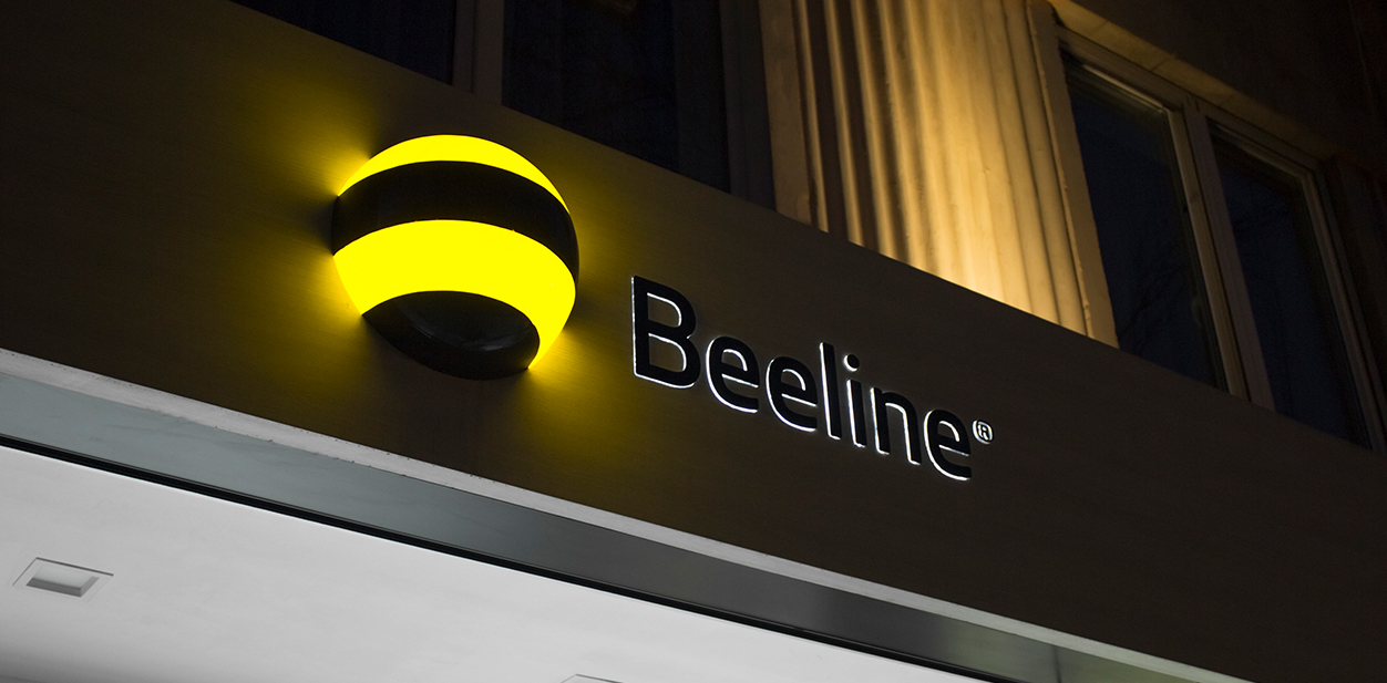 Beeline illuminated branding with the company name and logo